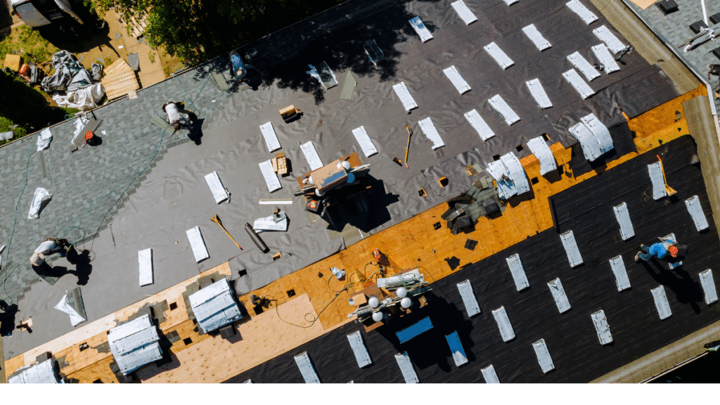 Aerial view of a large roof replacement project showing preparation for new roofing materials in Tampa.