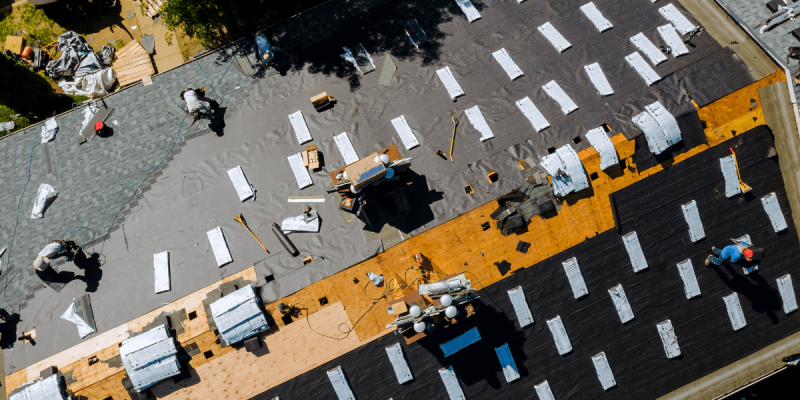 Aerial view of a large roof replacement project showing preparation for new roofing materials in Tampa.